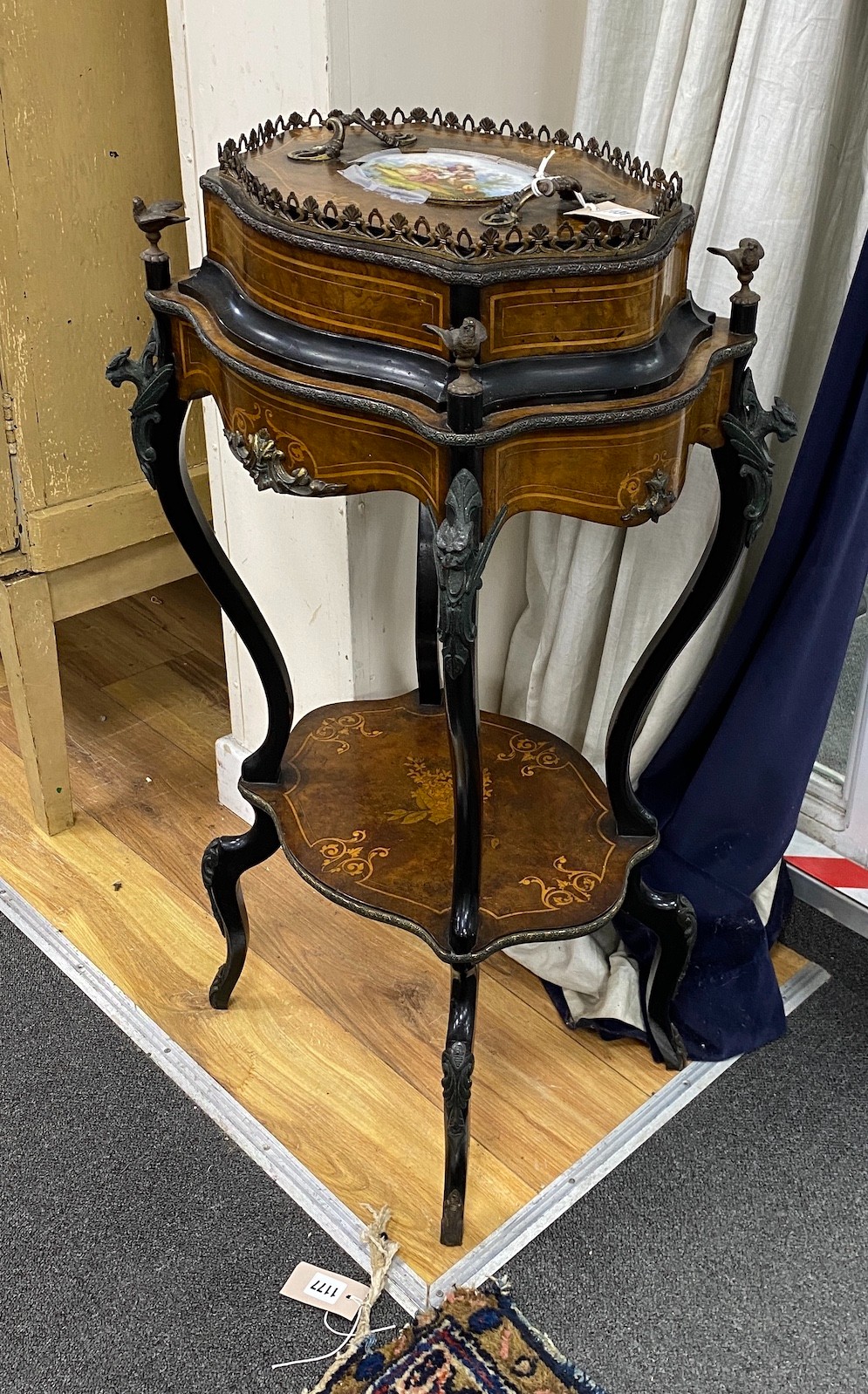 A 19th century French walnut and marquetry porcelain mounted two tier table, width 48cm, depth 35cm, height 88cm